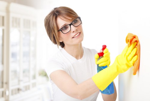 Carpet cleaning technician preparing equipment during a safety-focused visit