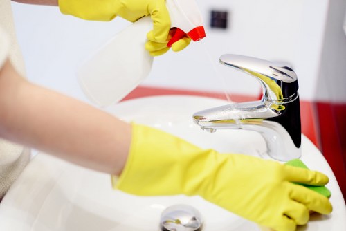 Cleaner preparing carpet cleaning equipment safely